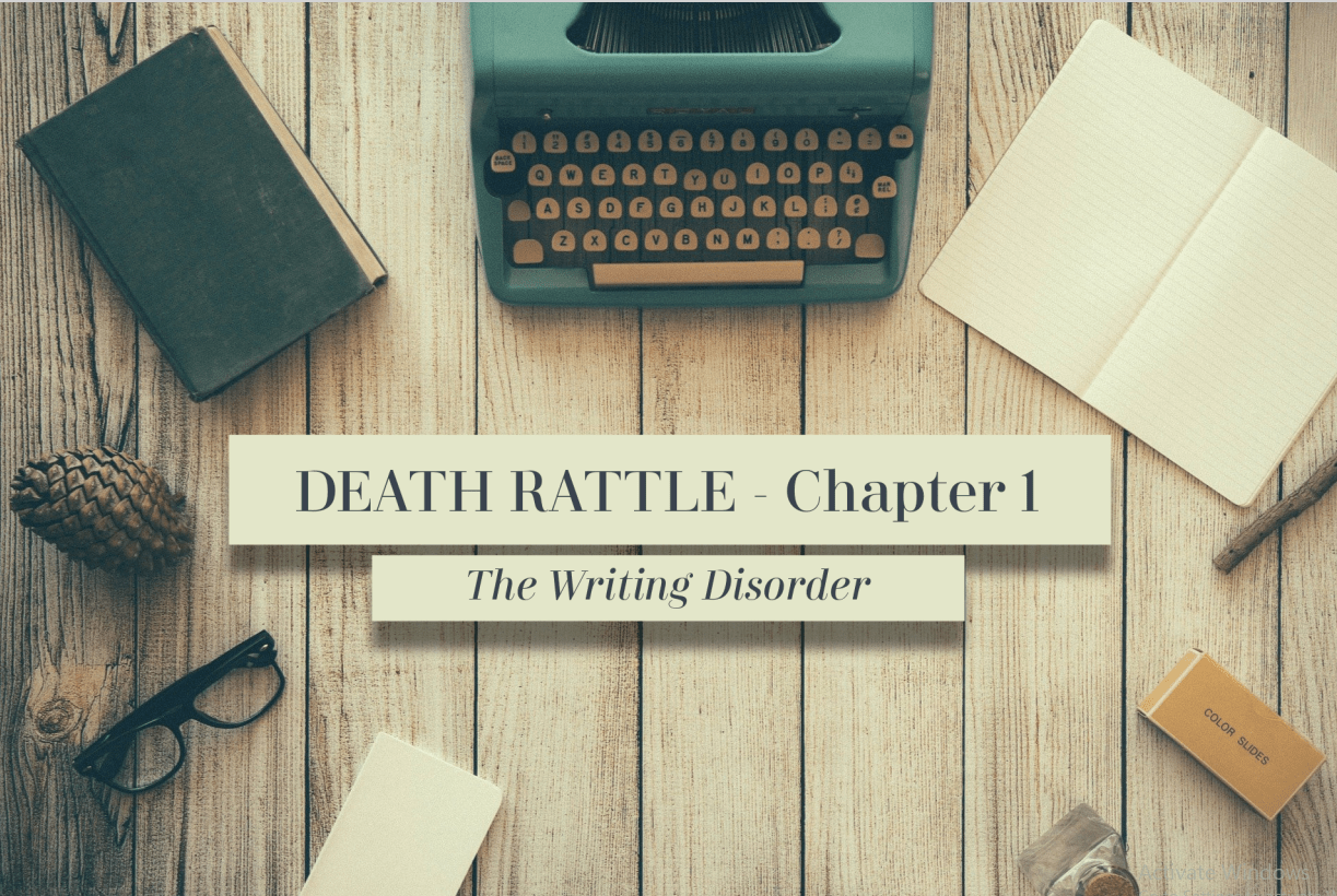 An image of a wooden tabletop from above. In the center, the image reads: "Death Rattle: Chapter 1. The Writing Disorder." Around the text lay a blue typewriter, an open empty notebook, a box of film slides, a pair of glasses, an old book, and a pinecone.